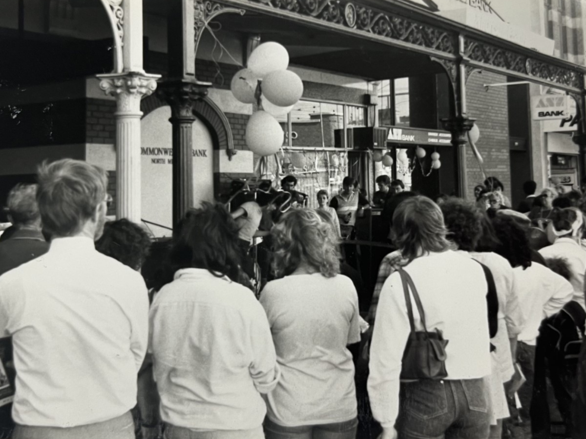 A woman picking up a brochure