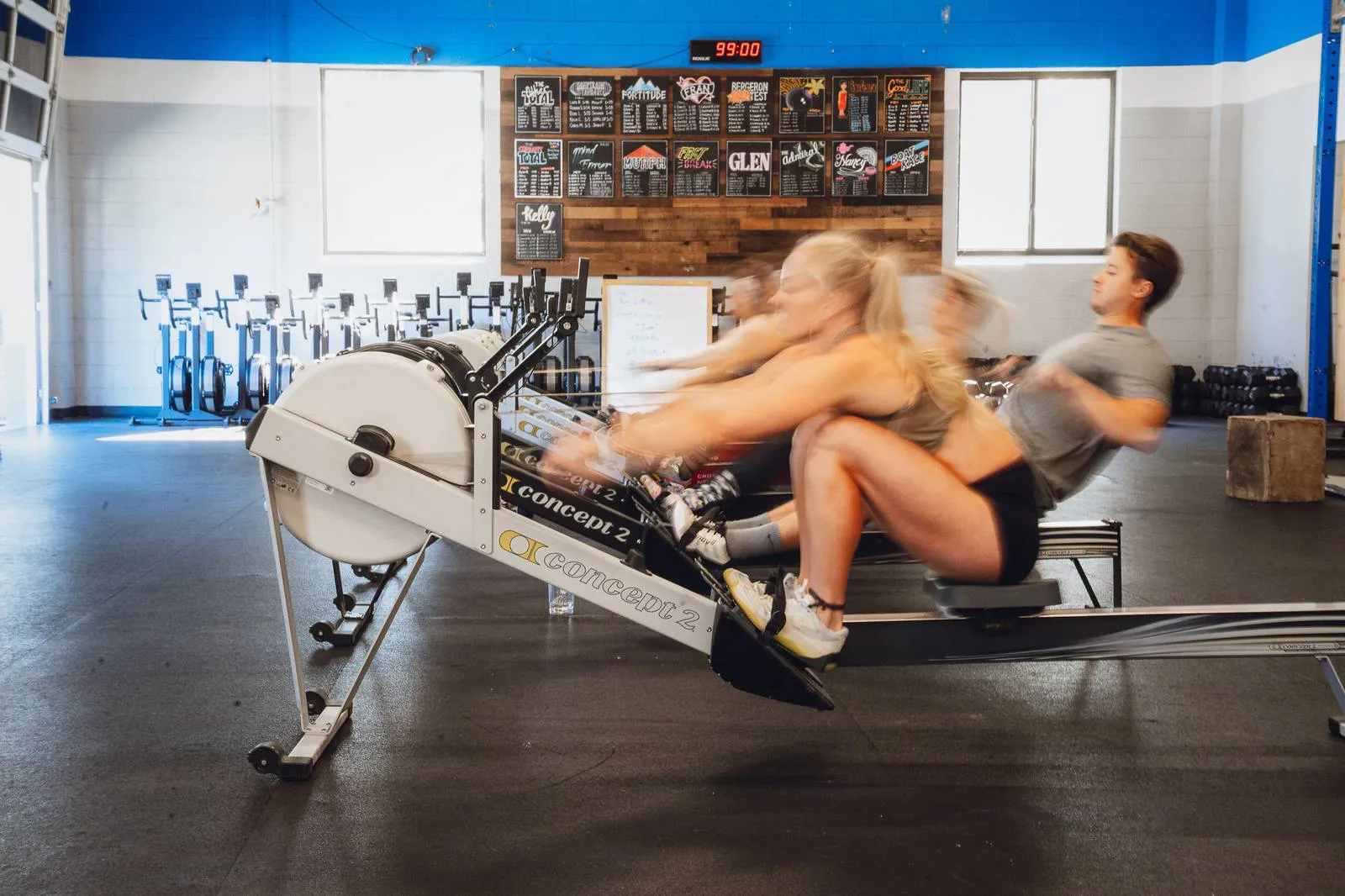 Members rowing hard in a coached class