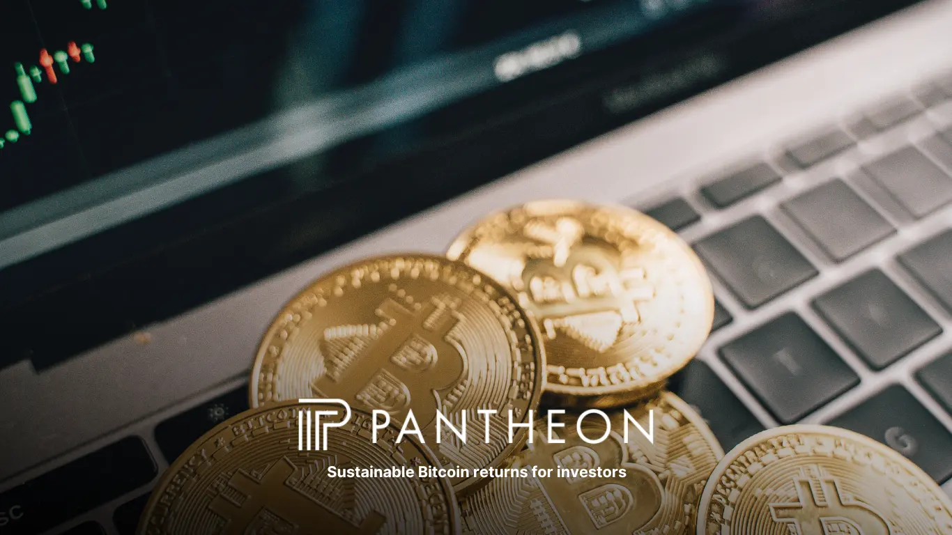 Bitcoin coins on a laptop keyboard with Pantheon logo and tagline