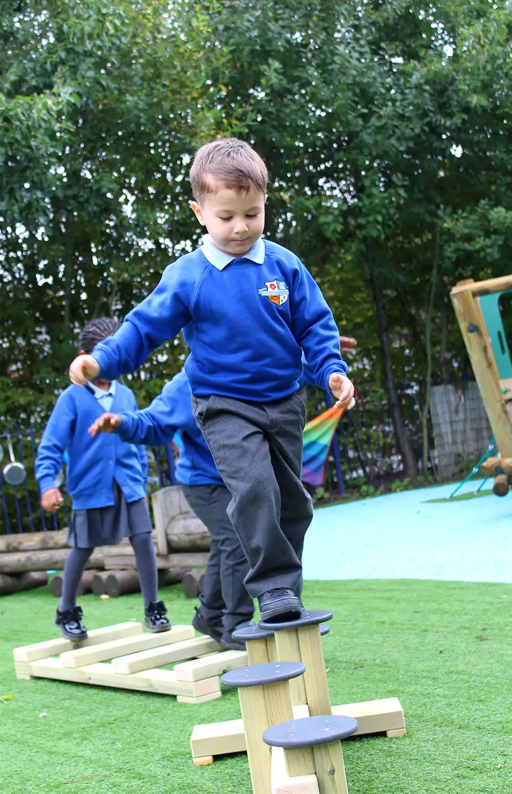 A boy from a Primary School concentrates walking over our Exercise Balance Set