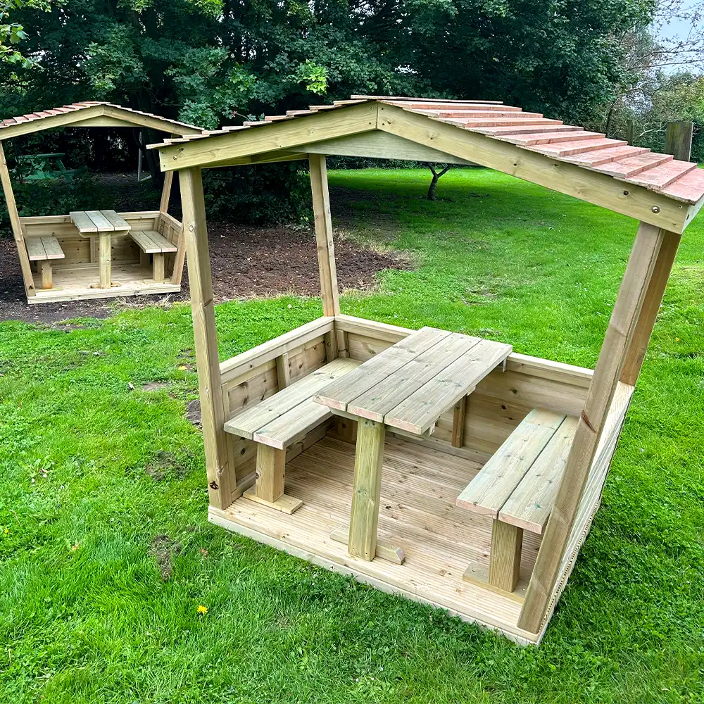 Play Huts with Seats in a grassy area