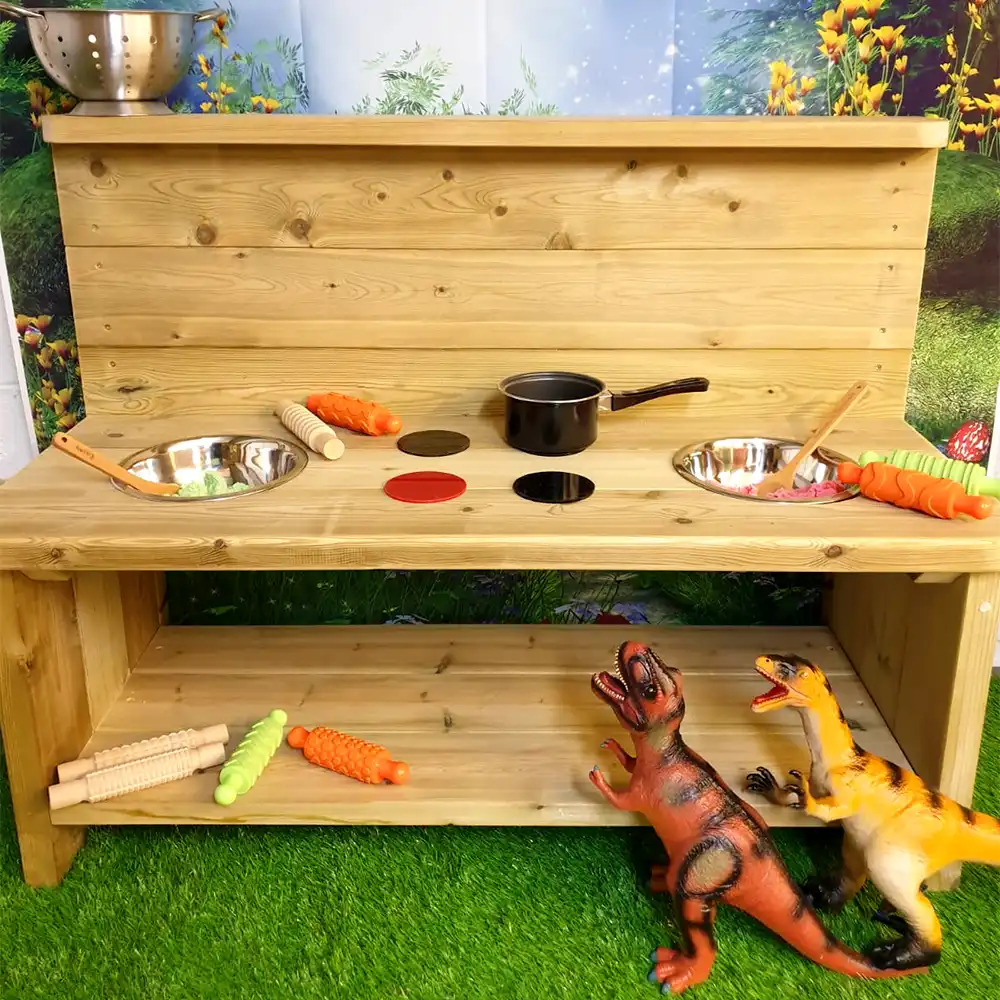 The Mud Kitchen Windsor in use with accessories at a nursery