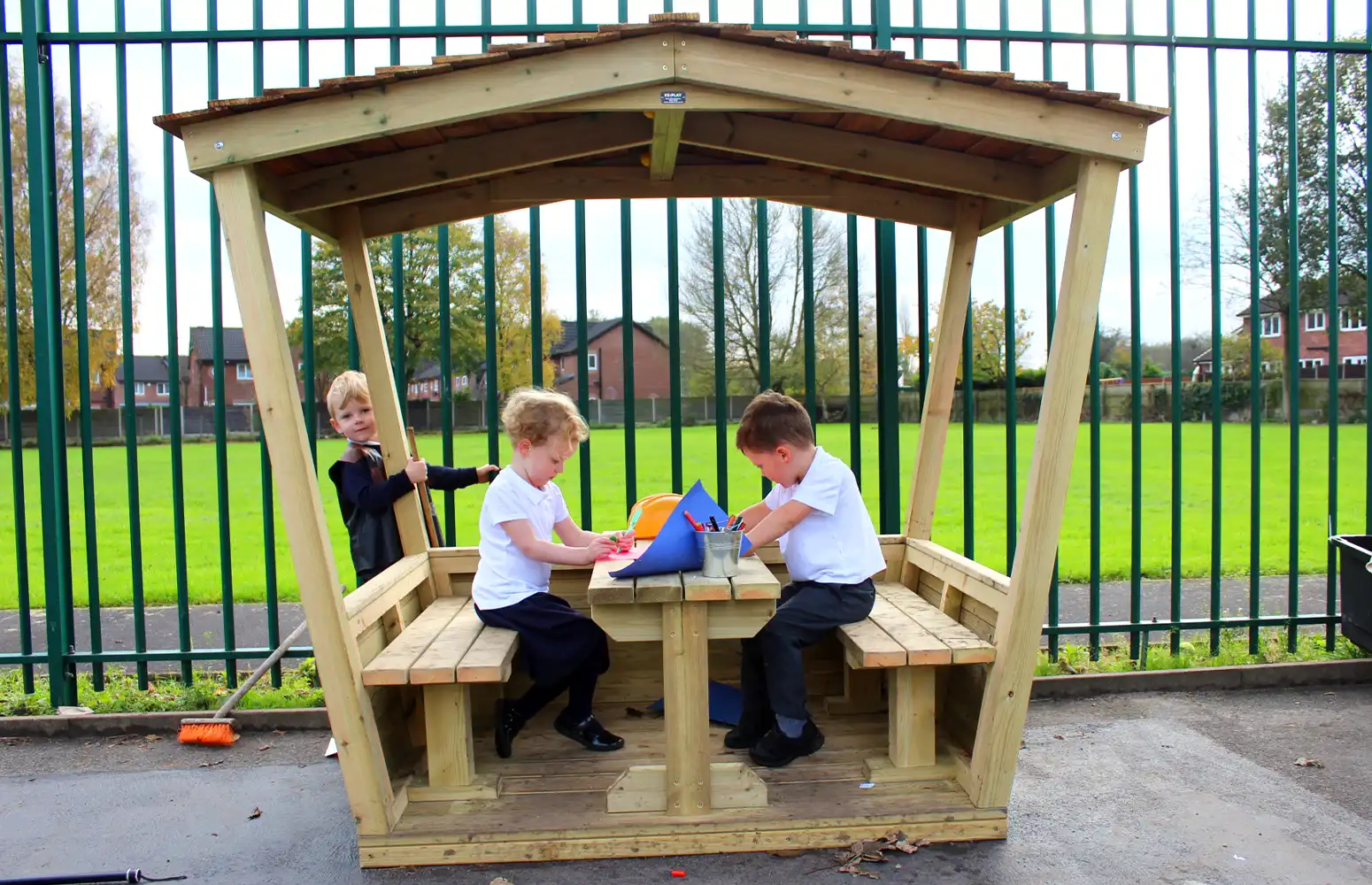 Two Primary School Children working inside our Play Hut with Seats