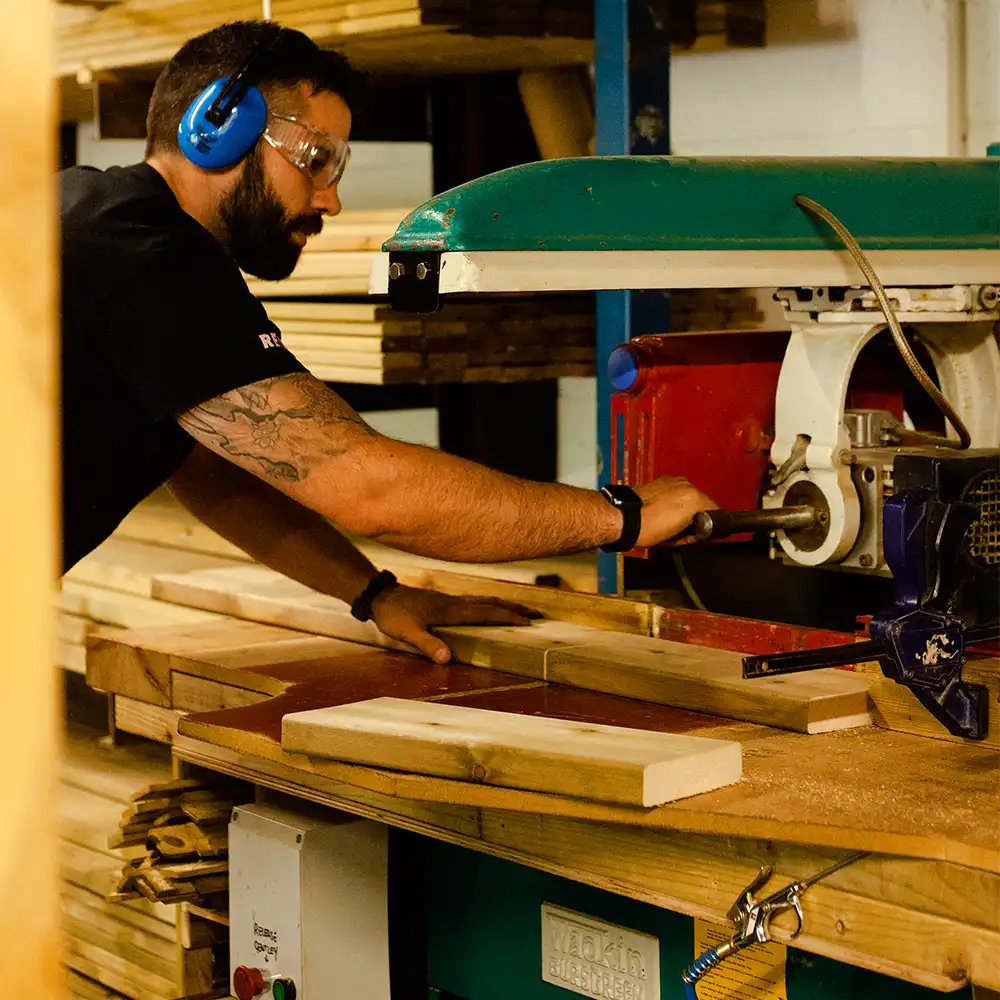 Cutting Scandinavian Redwood ready to create our playground products