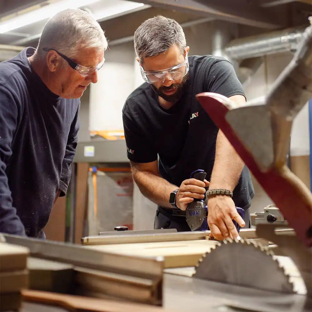 Our Warehouse Manager guiding our Warehouse Assistant on cutting material
