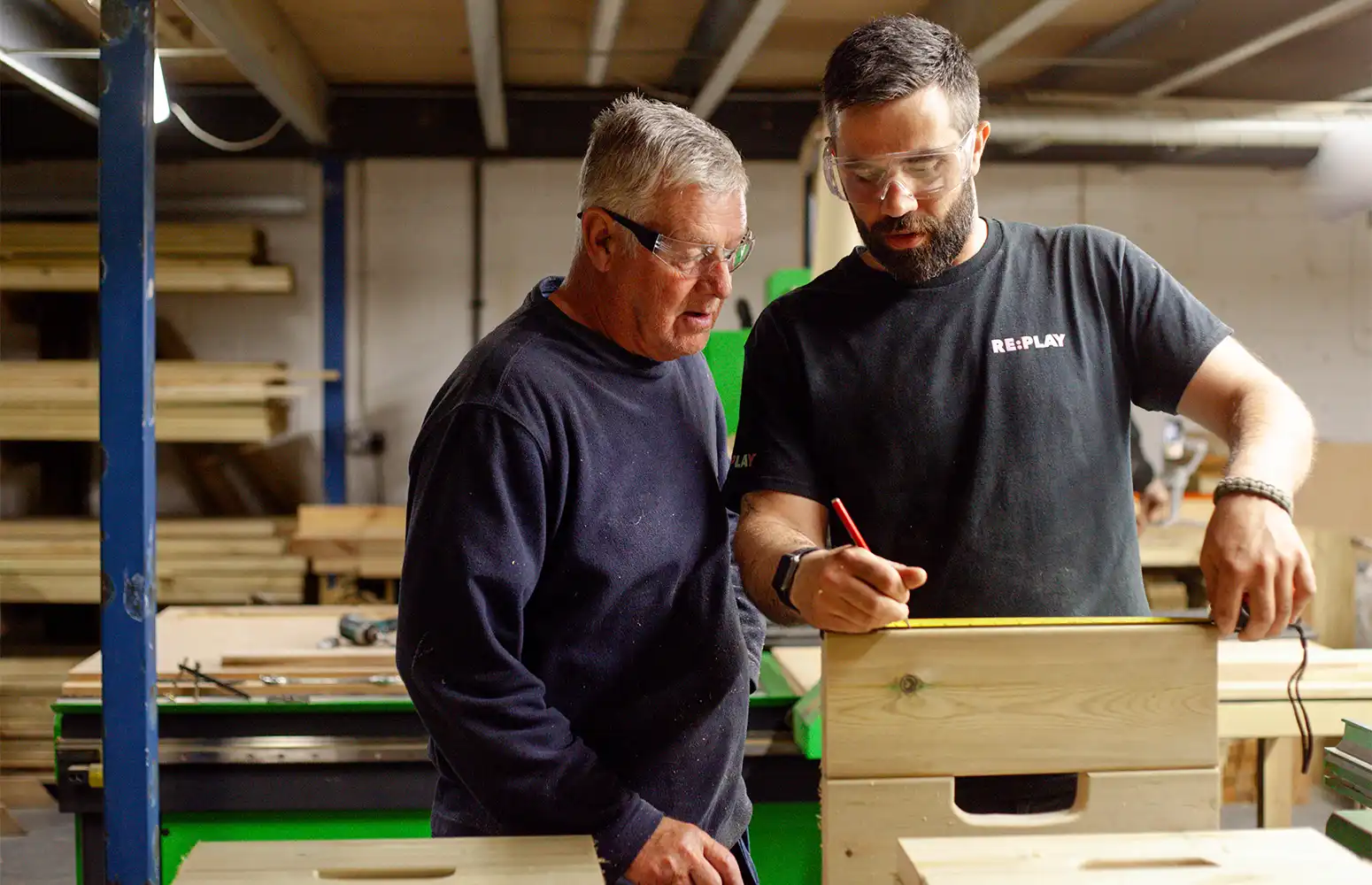 Our Warehouse Manager guiding our Warehouse Assistant on measuring material