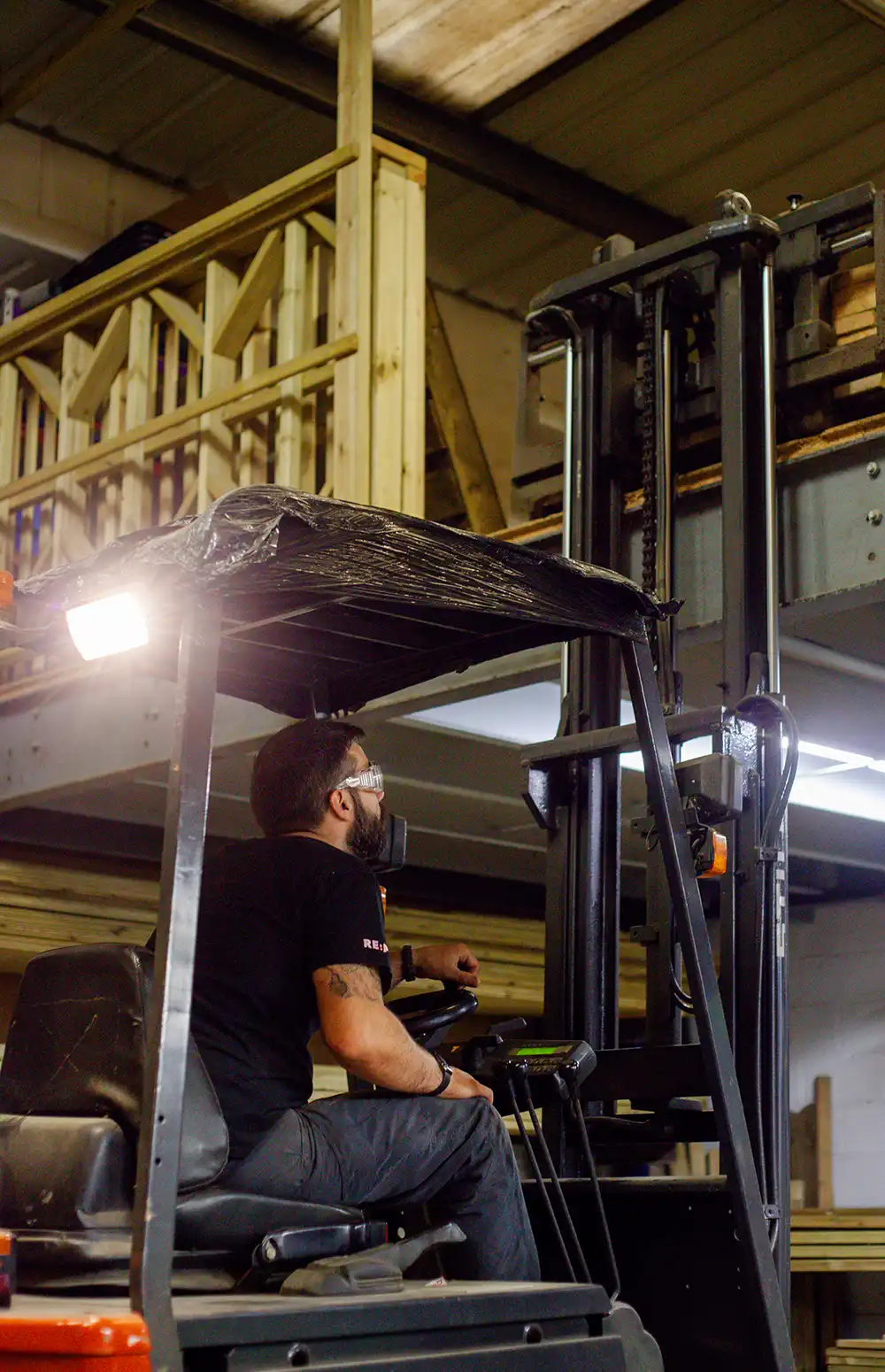 Using our forklift to move a completed order from the mezzanine to the our van