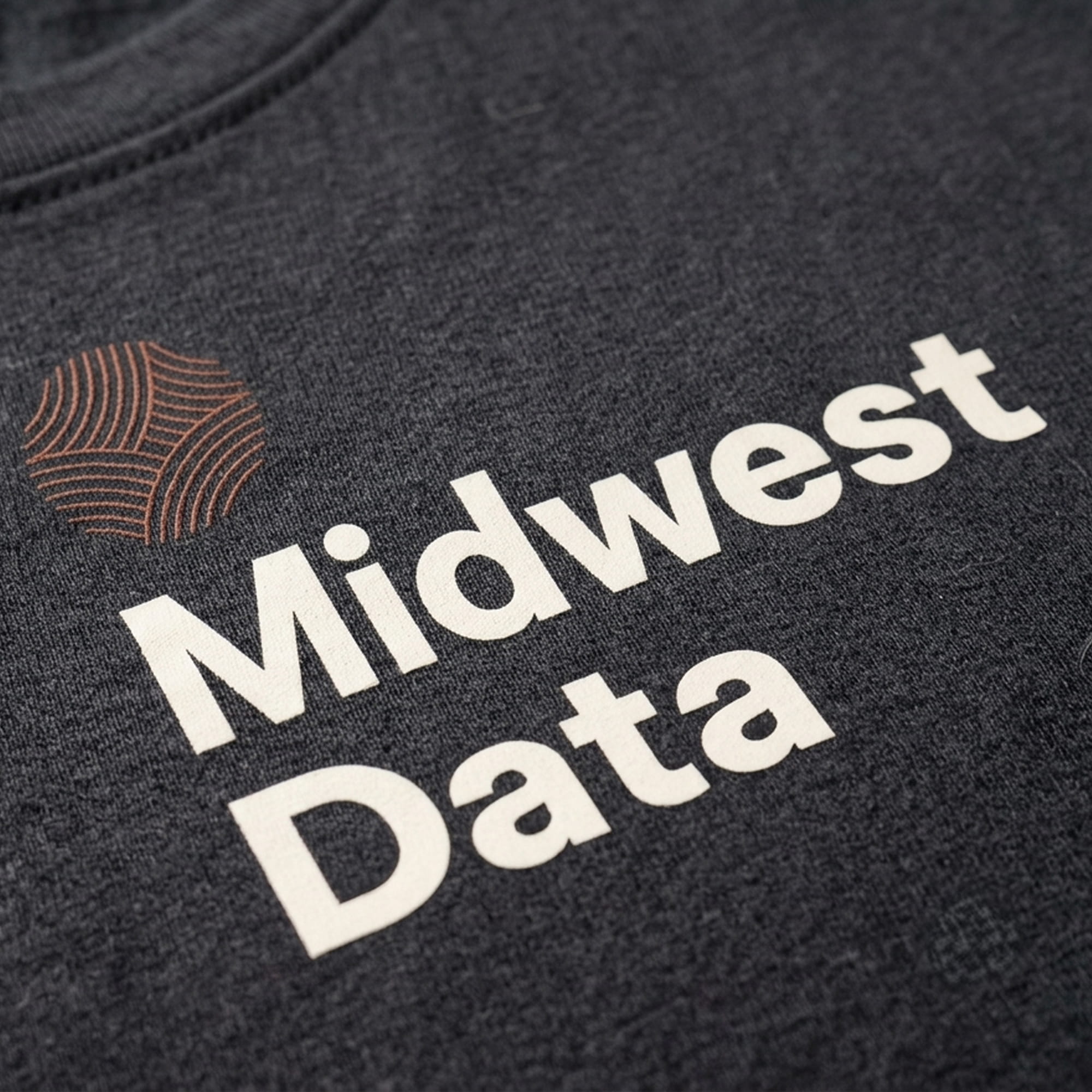 Dark gray fabric with white text reading Midwest Data and a circular brown logo above the text.