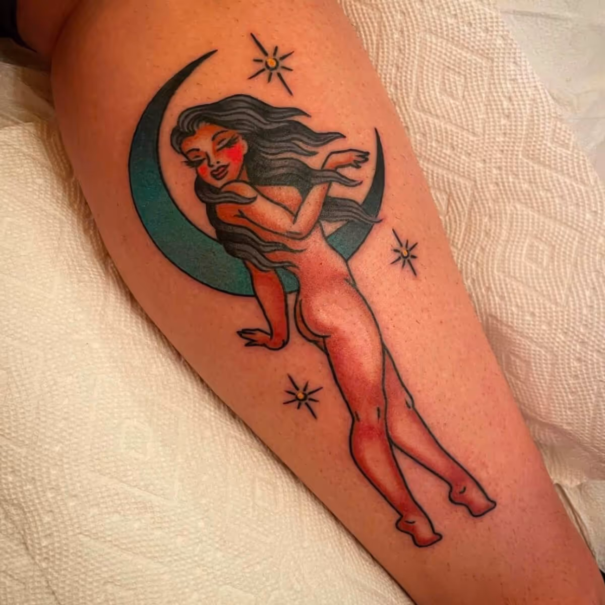 Traditional nude with posing with blue moon by Brittany Quintero of Sweet Heart Tattoo.