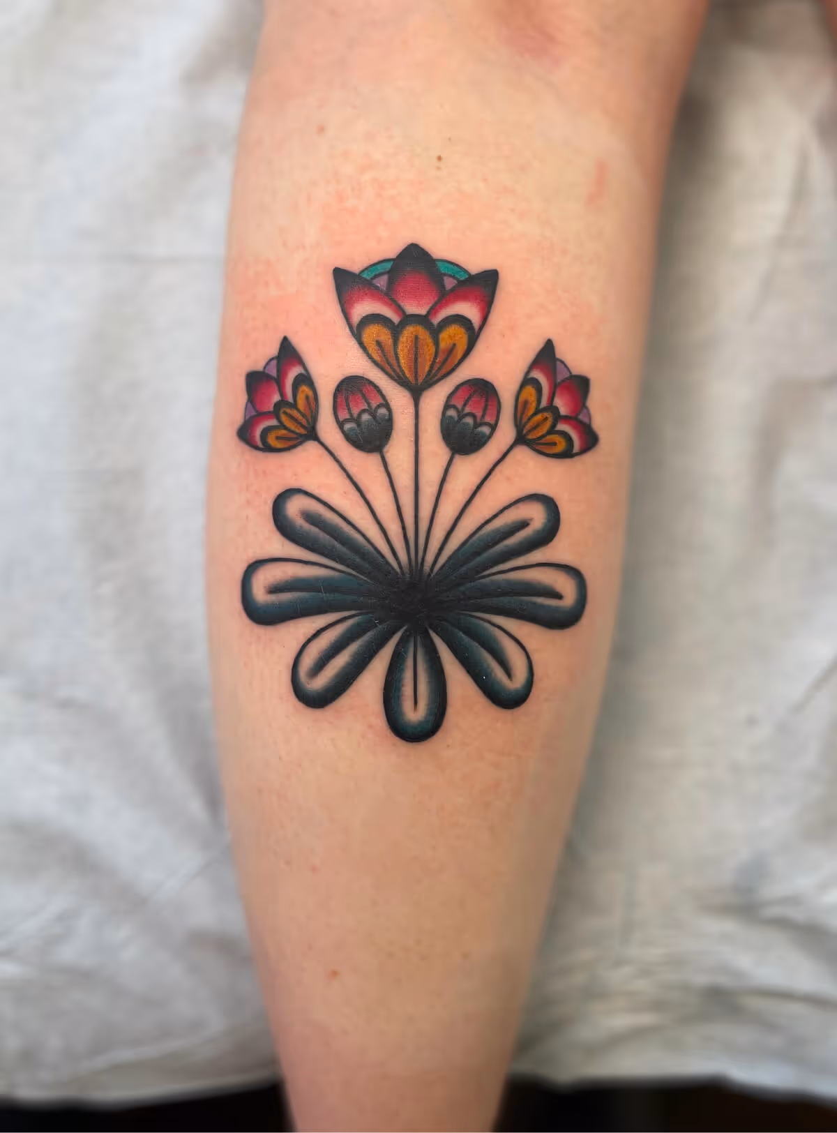 Traditional flowers by Brittany Quintero of Sweet Heart Tattoo.