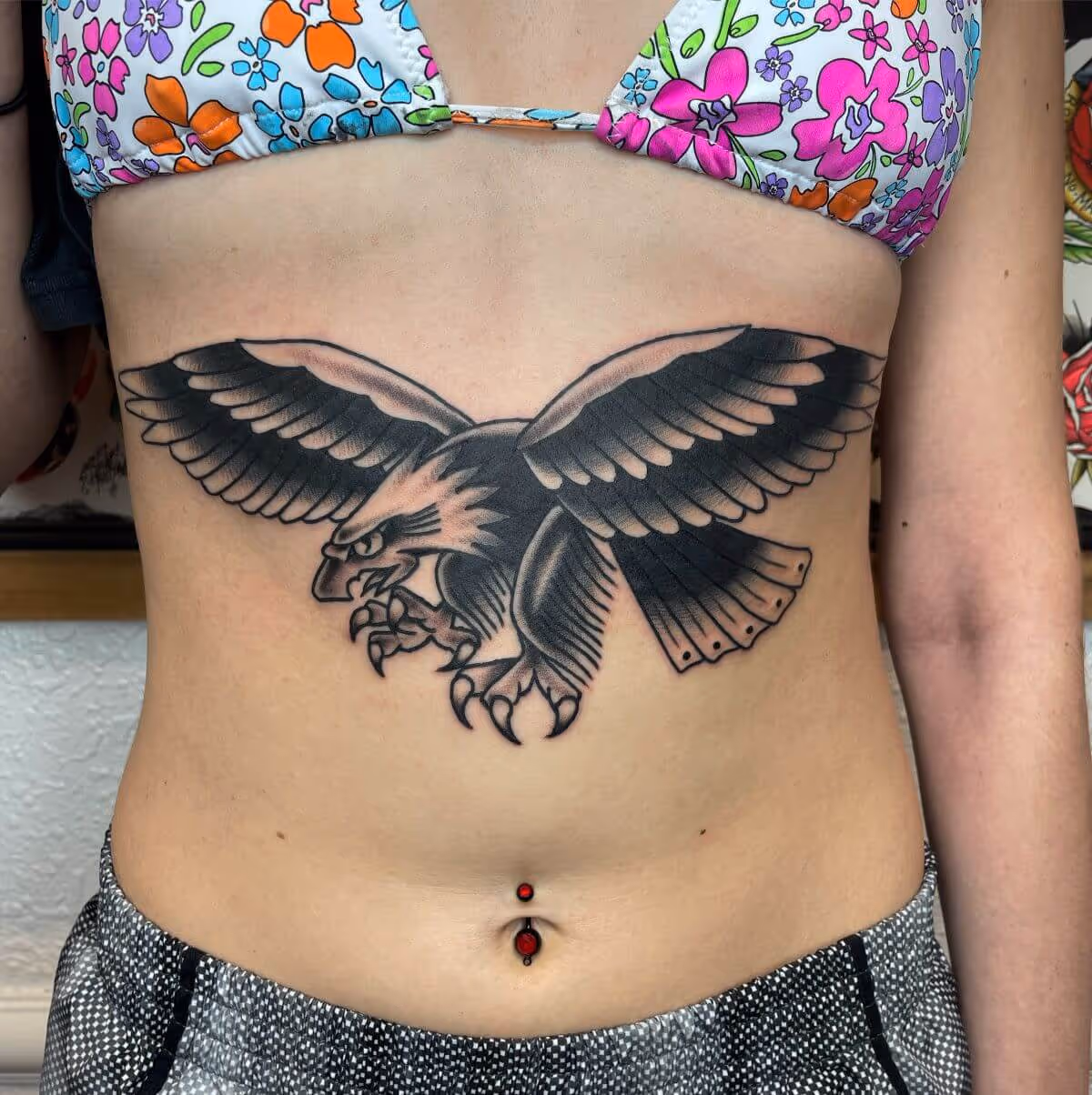 Traditional black and grey eagle tattooed on sternum by Joshua Bighaus