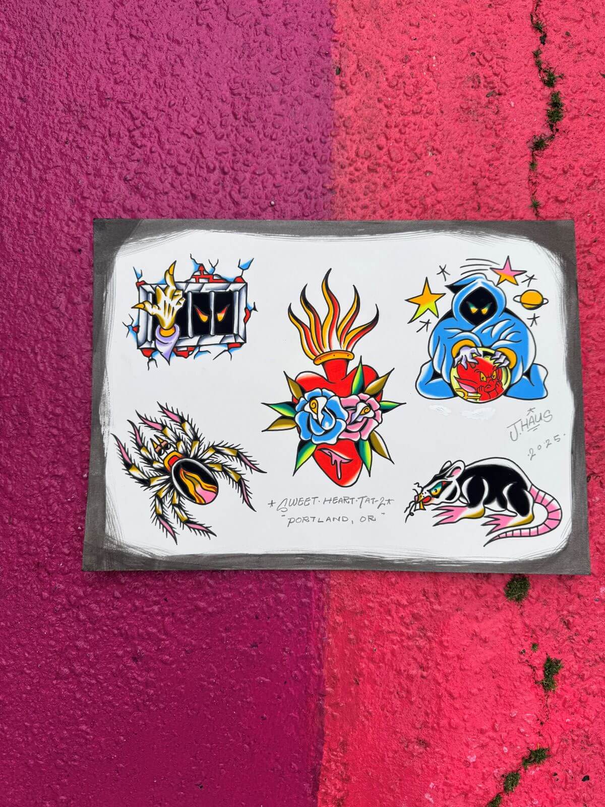 Tattoo flash sheet with designs of a hand breaking through prison bars, a spider, a flaming heart with roses, a hooded figure with a crystal ball, and a rat eating cheese, signed by J. Haus.