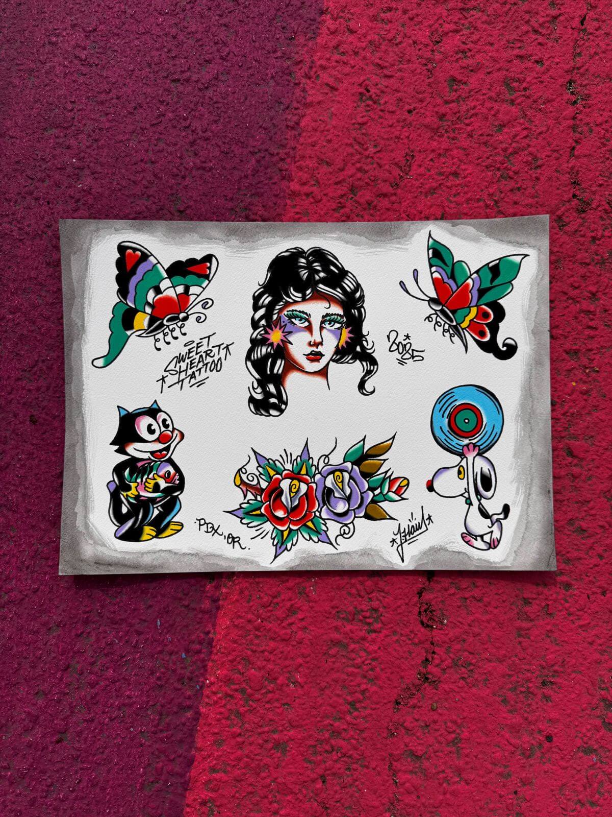 Tattoo flash sheet featuring a stylized woman’s face, colorful butterflies, cartoon cat, flowers, and a dog holding a vinyl record on a textured pink and purple background.