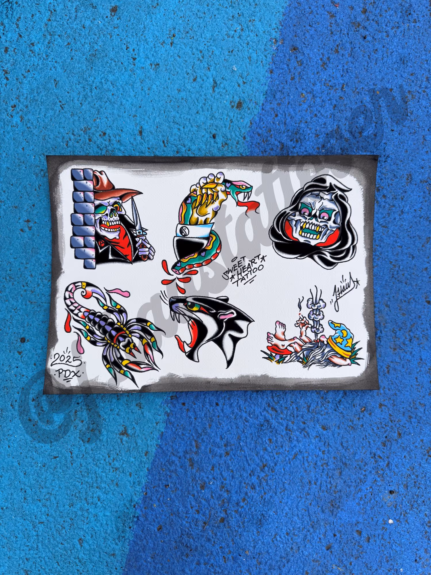 Traditional tattoo flash sheet featuring six colorful designs including a skeleton with a knife, a snake being grabbed, a skull in a hood, a scorpion, a roaring black panther head, and a wizard.