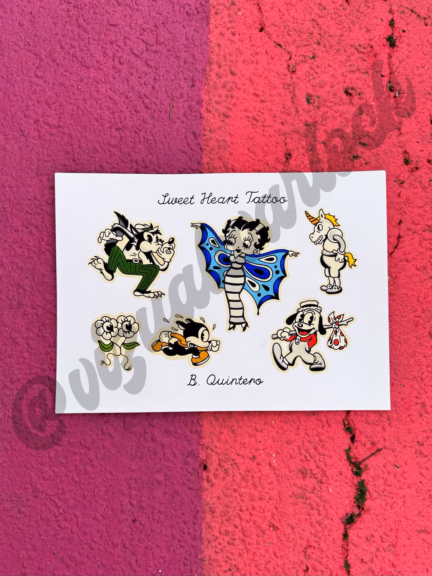 White sheet with six colorful cartoon-style tattoo flash designs by Brittany Quintero.