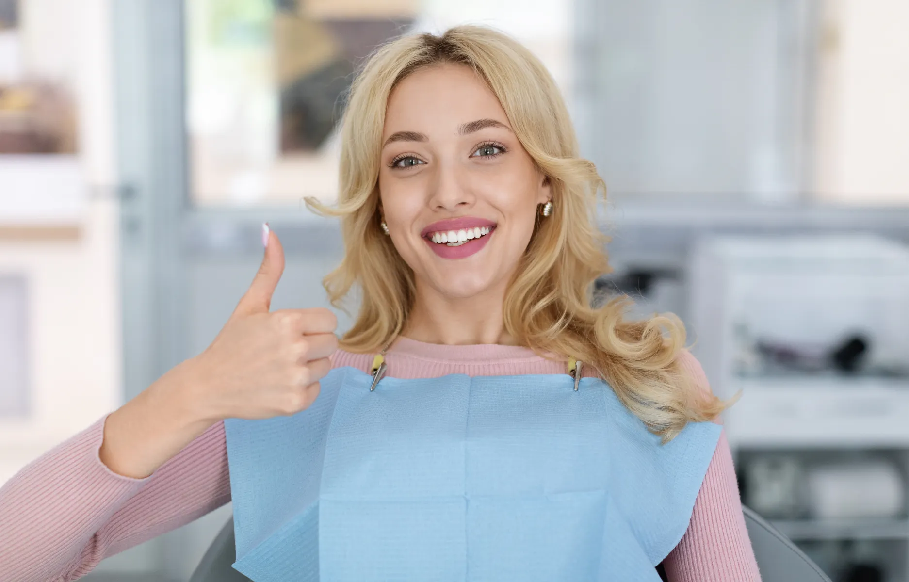 a group of dentists standing in front of a dental office