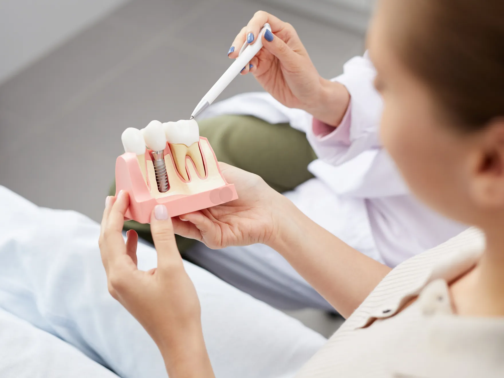Dentist explaining dental implants to patient
