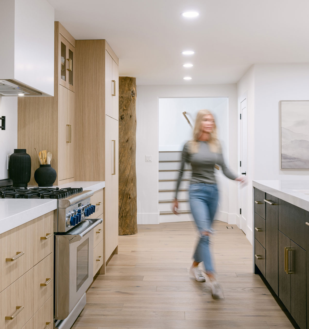 Homeowner walking through their custom kitchen