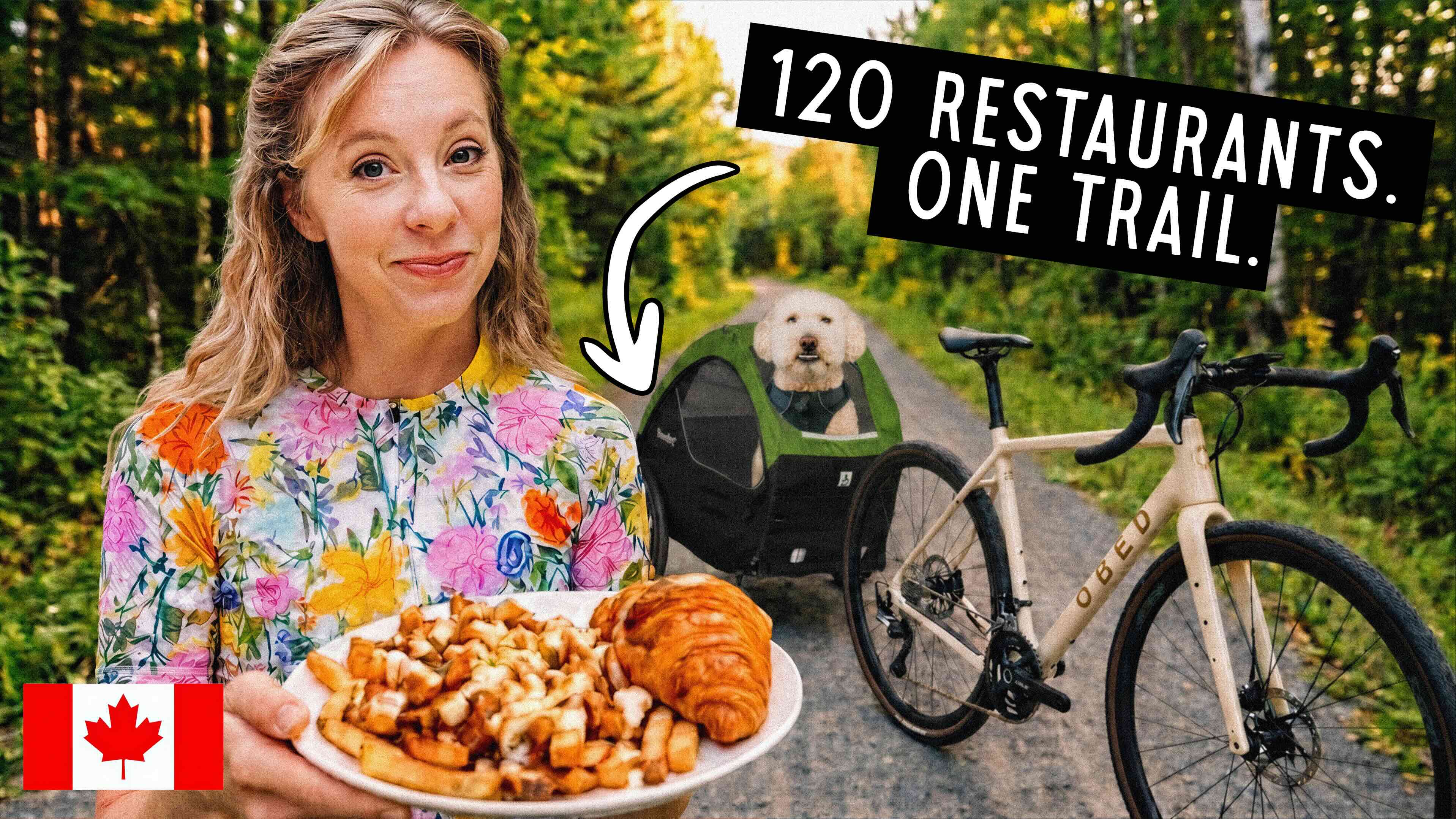 Sara holding a plate of poutine on a bike trail in Quebec, with Kramer the dog in a bike trailer behind her