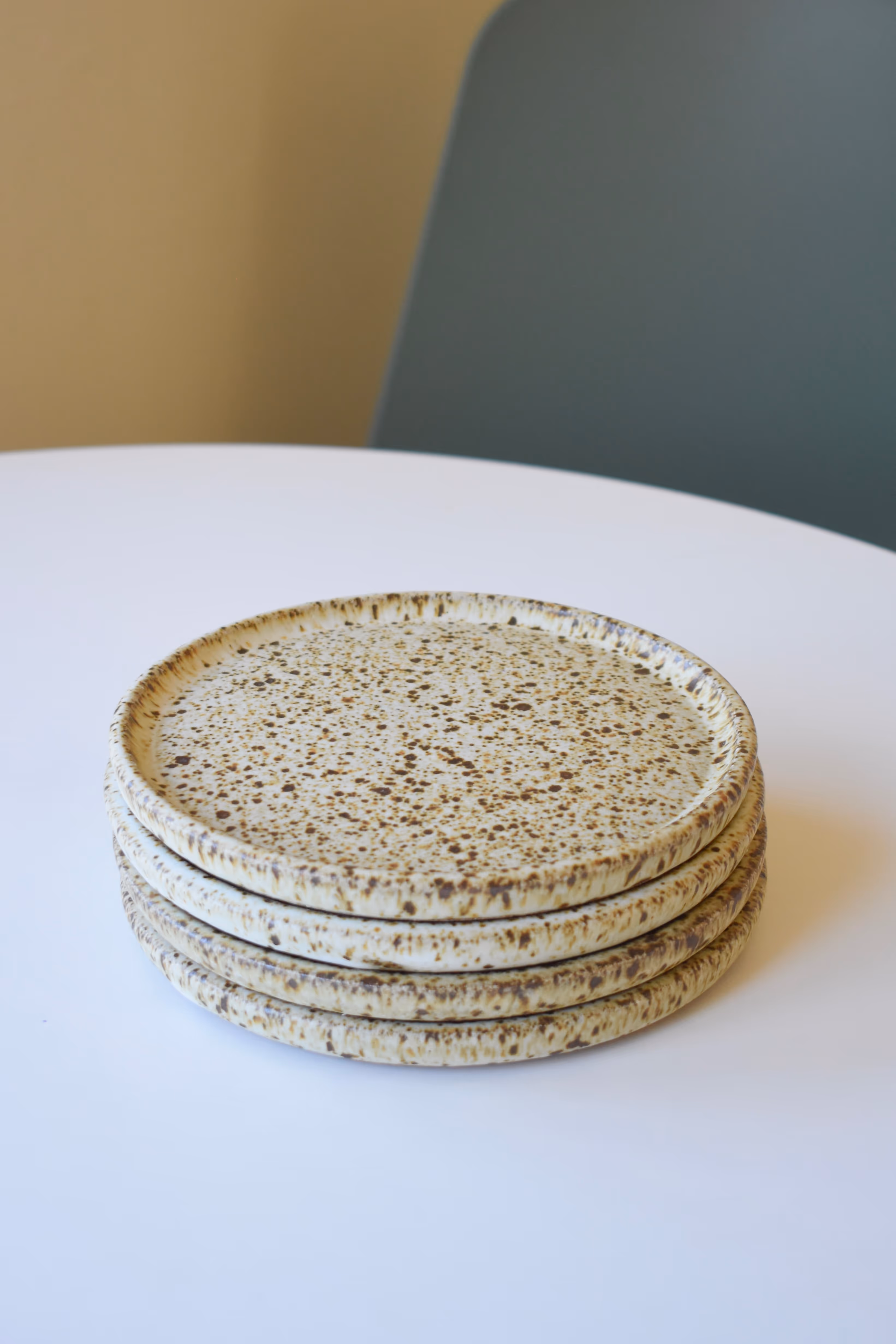 Speckled off white and brown dinner plates.