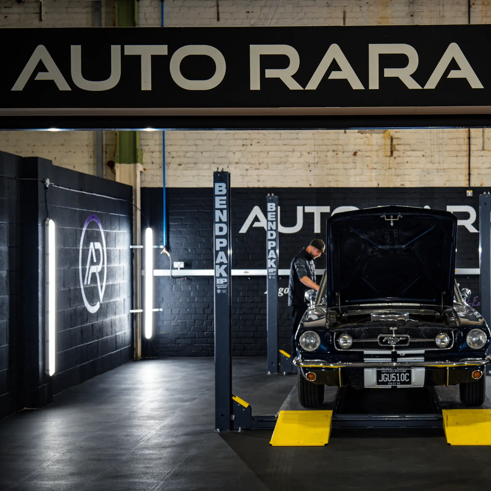 A classic Ford Mustang undergoing inspection in the Auto RARA Assessment Centre