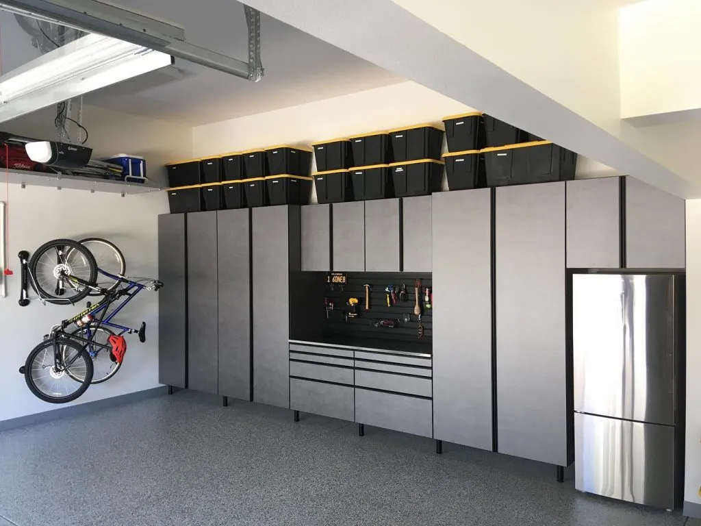 grey cabinets with a workbench. 