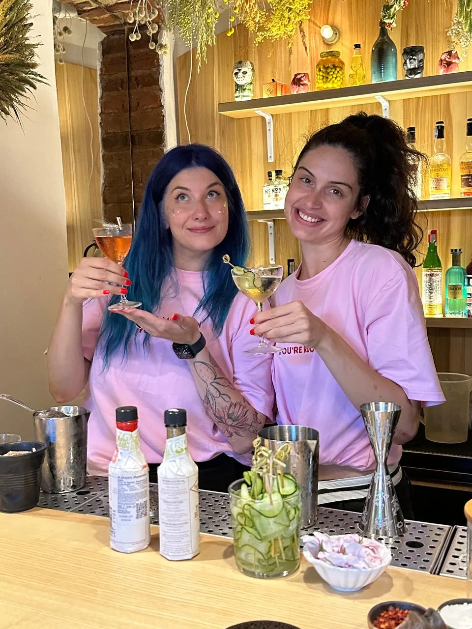 Hot Mamas co-founders Natalka and Dana making cocktails.
