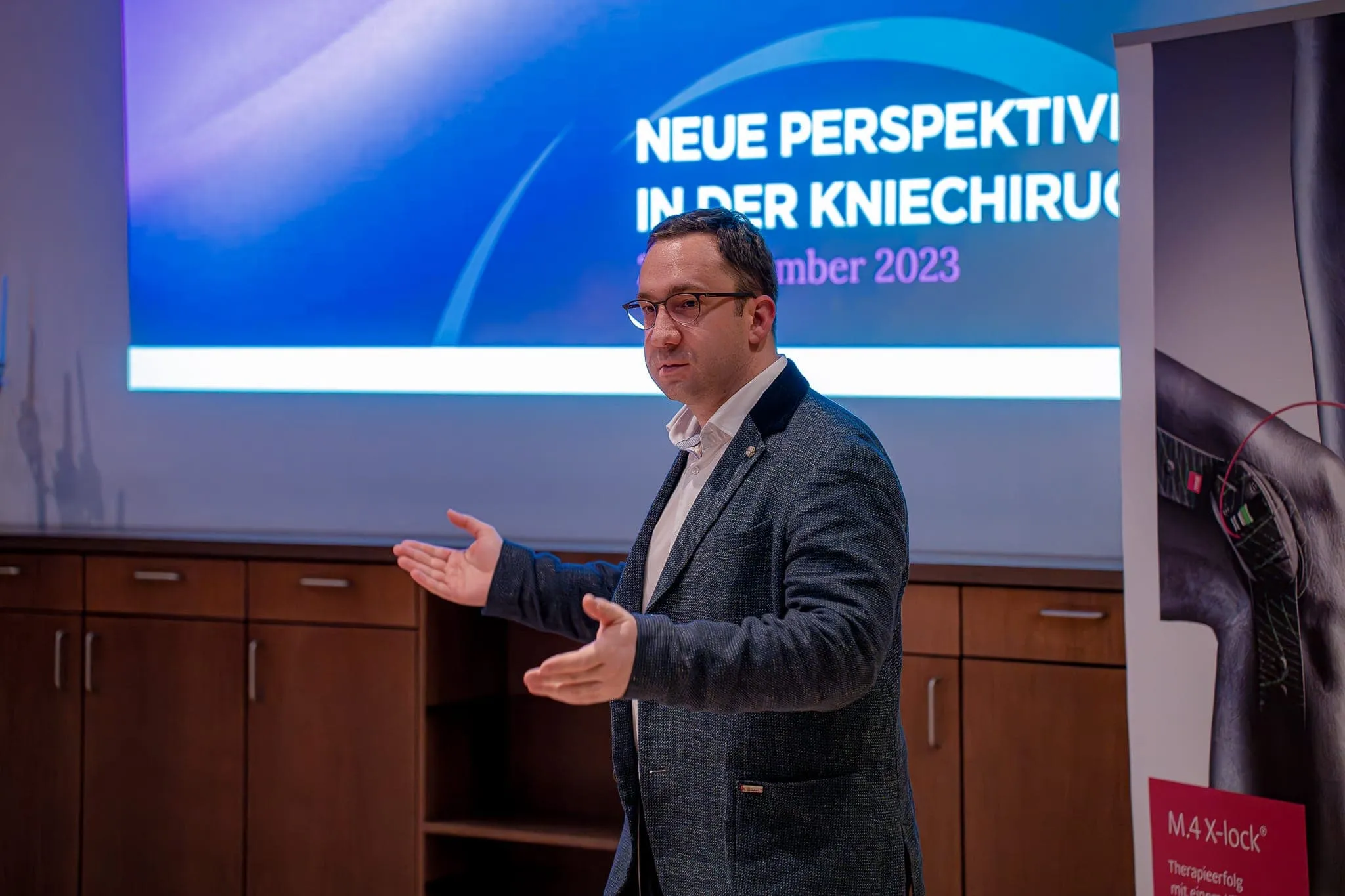Medizinischer Fachvortrag mit Präsentationsfolie beim Knieforum Münsterland