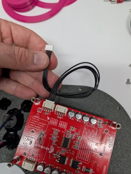 Step 15: Install batteries and battery board image 1