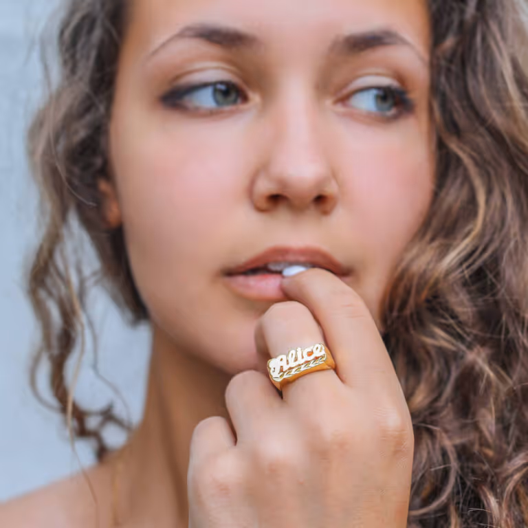 Collage showing a woman in a striped short-sleeve top, a close-up of a person opening a light green jacket over a white tank, images of a gray and beige hoodie, teal polo shirt, black sweater, olive green long sleeve top, and a man wearing a mustard short-sleeve button-up shirt.