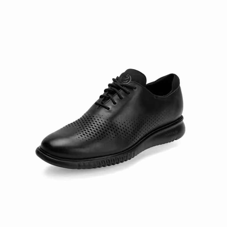Black leather lace-up shoe with perforated design and textured sole.