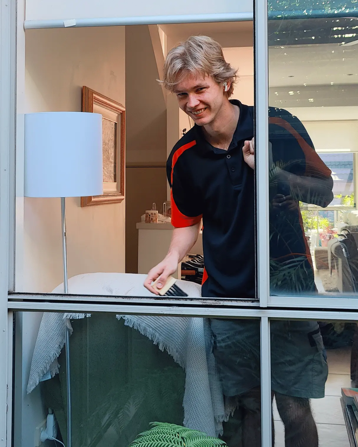 Dazzler team member detailing a window sill