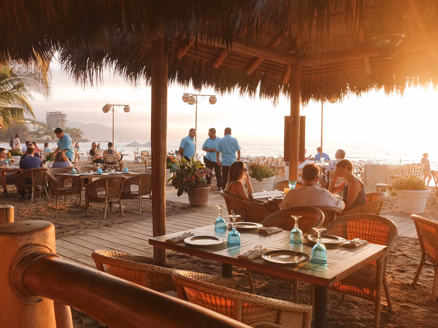 Lunch service on the terrace under the palapa roof at El Dorado