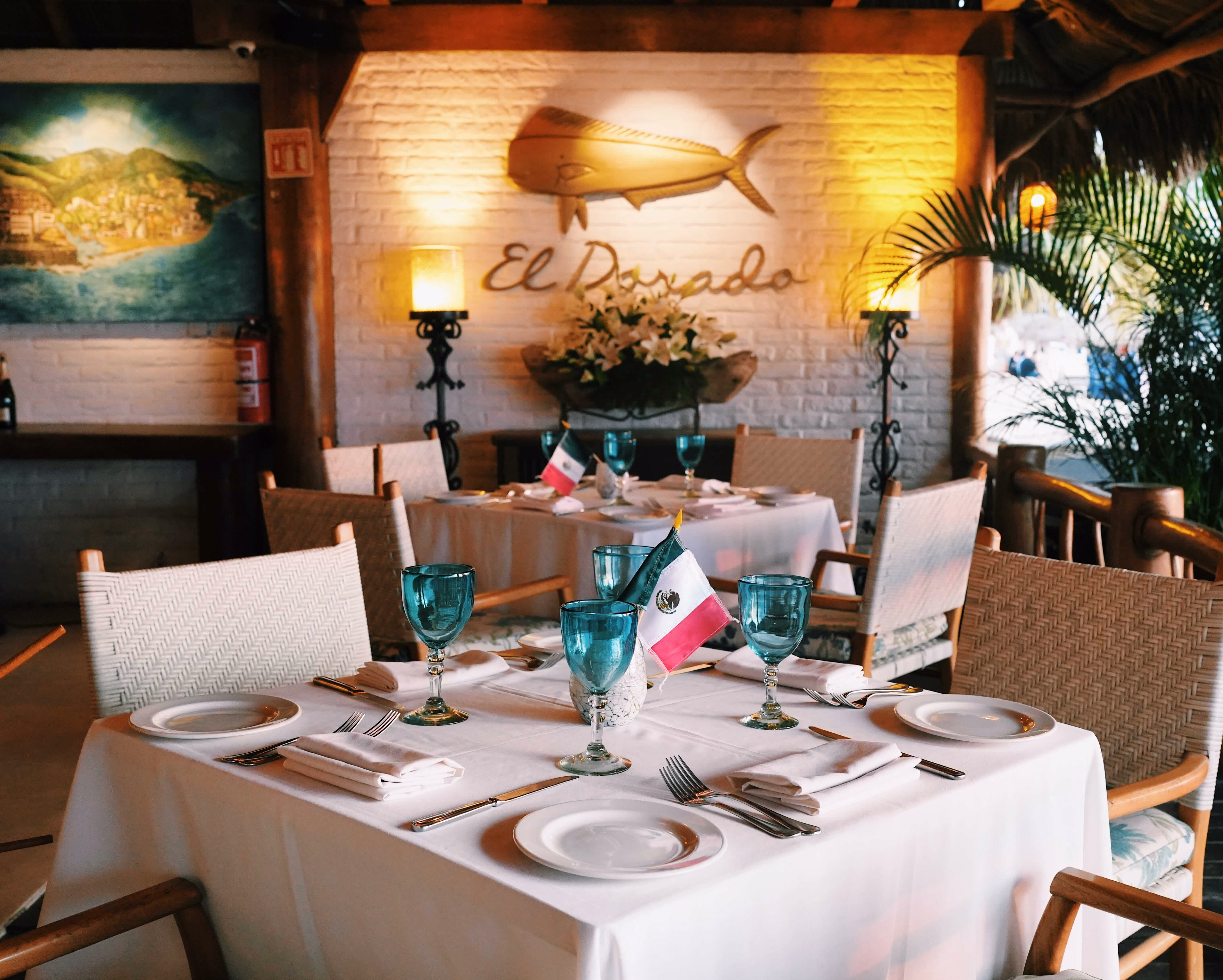 El Dorado dining room set for Noche Mexicana with Mexican flags