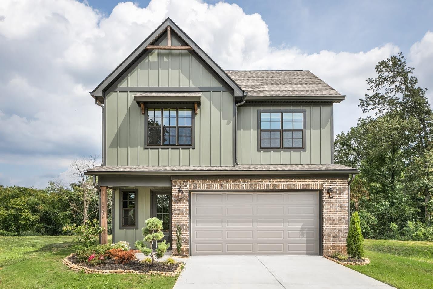 custom home in Chattanooga tn with green exterior and 2 car garage