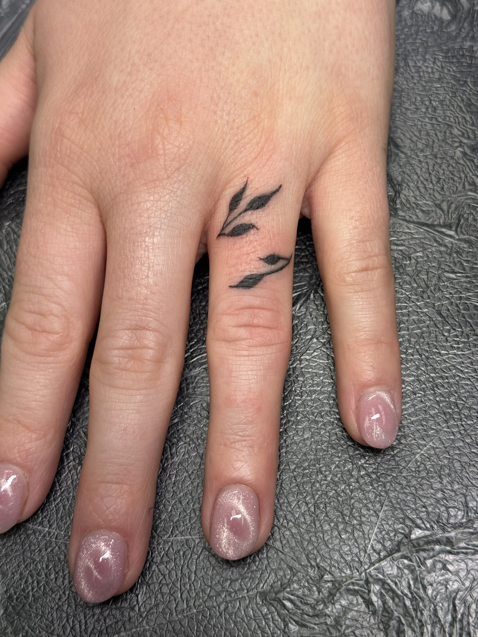 Elegant finger tattoos for women in fine line ornamental tattoo style. These trending tattoo ideas can be done at the best private tattoo studio in Pittsburgh and Glenshaw close to Butler, PA and Allison Park and North Hills. 