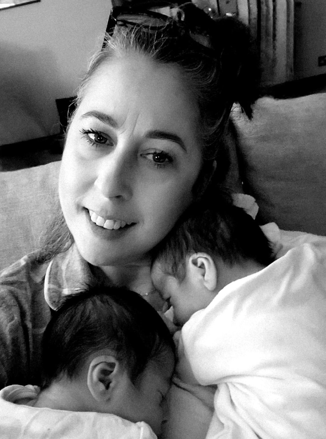Picture of Sinead Davin feeding baby in black and white