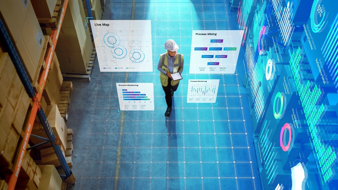 A person standing in a room with several white postersDescription automatically generated