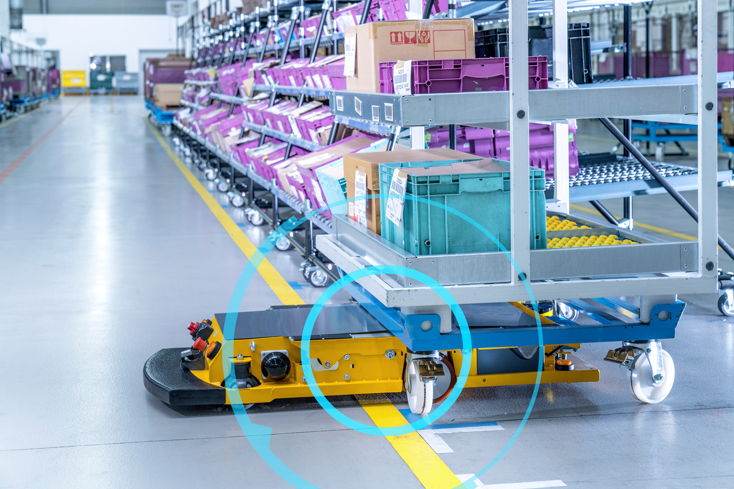 This is a photo of an AGV picking up a box 