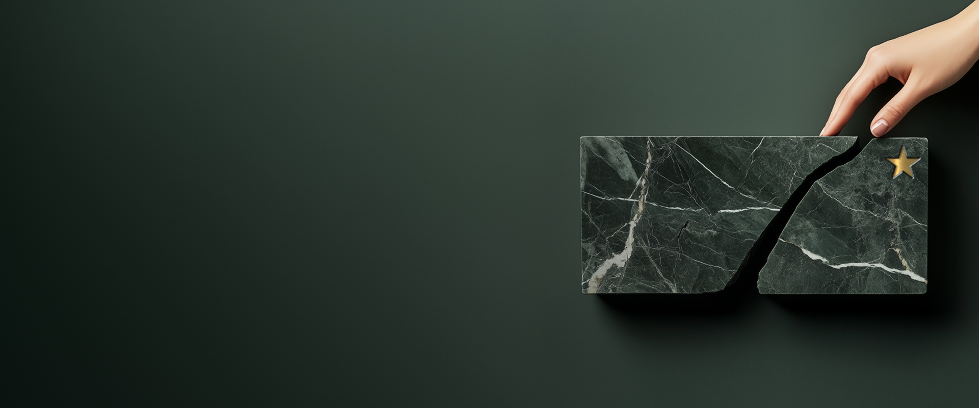 Hand hovering over broken marble representing retained earnings. 