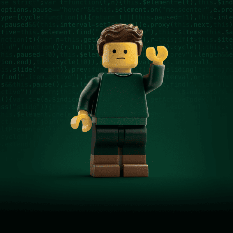 A lego man stands with his arm raised in front of a screen of code, demonstrating building a lightweight design system.