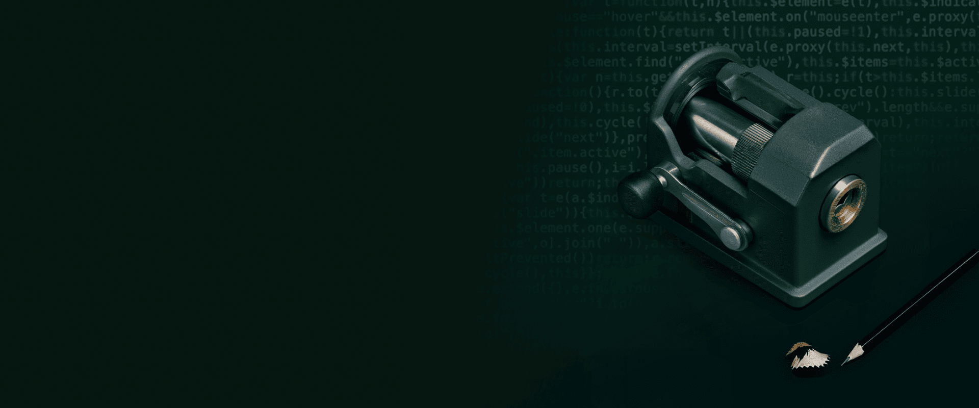Pencil sharpener in front of a faded background of code to represent the way AI helps engineers sharpen their thinking.