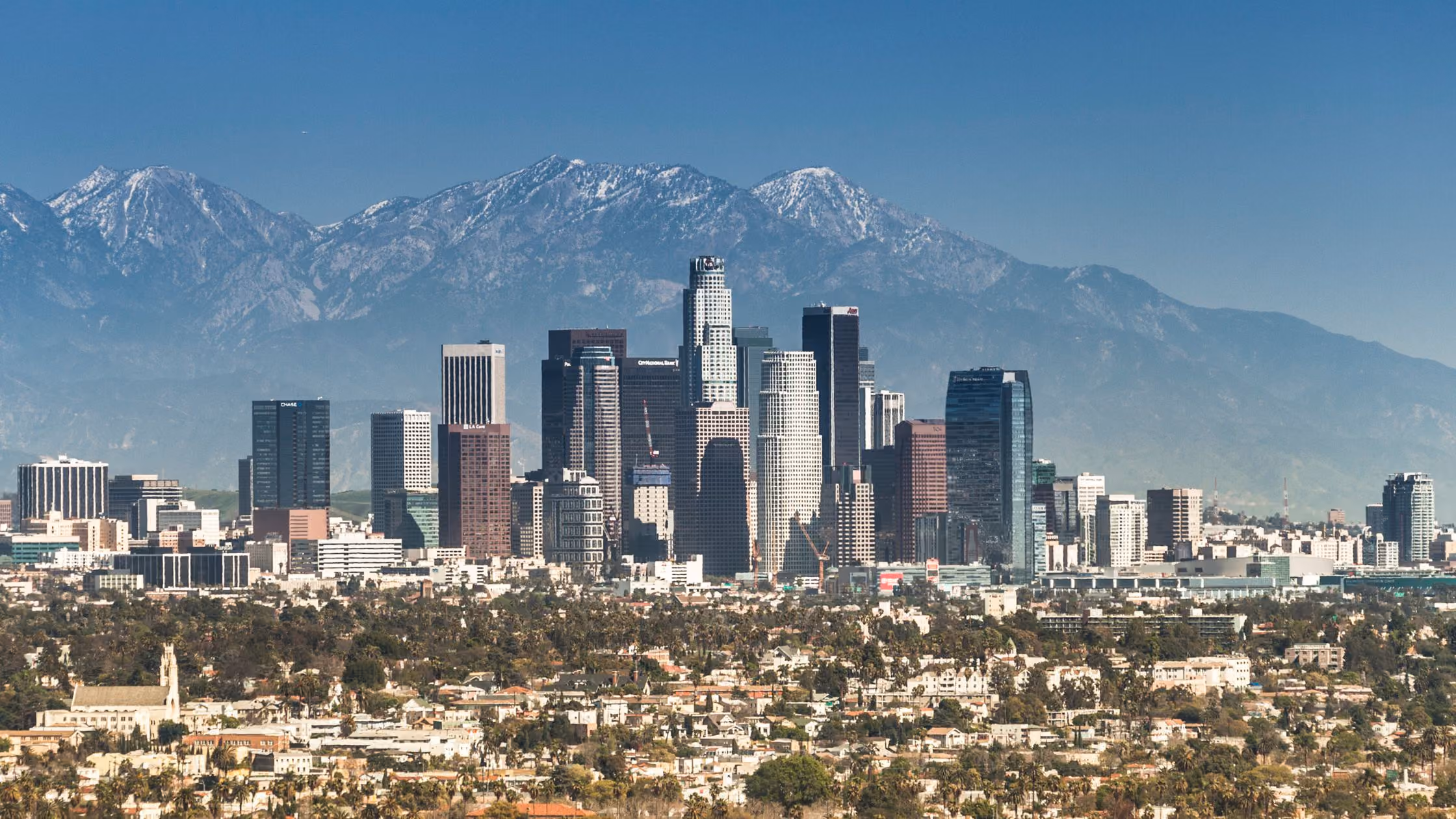 Downtown Los Angeles skyline with mountains in the distance