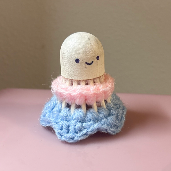 A crocheted badminton bird