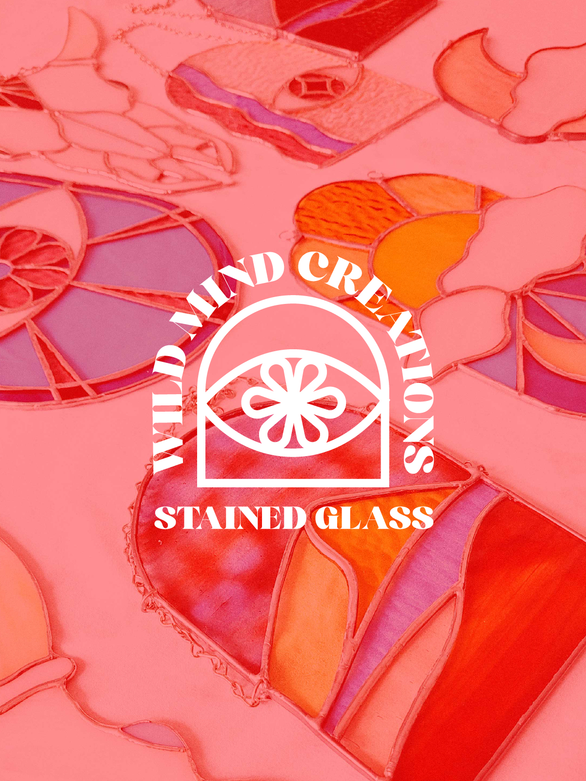 Wild Mind Creations logo on picture of stained glass art