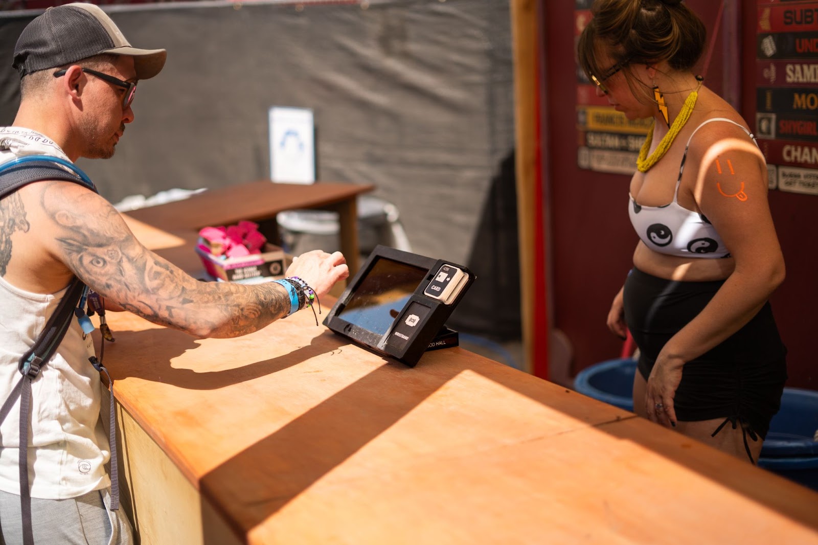 Modern venue POS technology terminal with dual screens at music festival