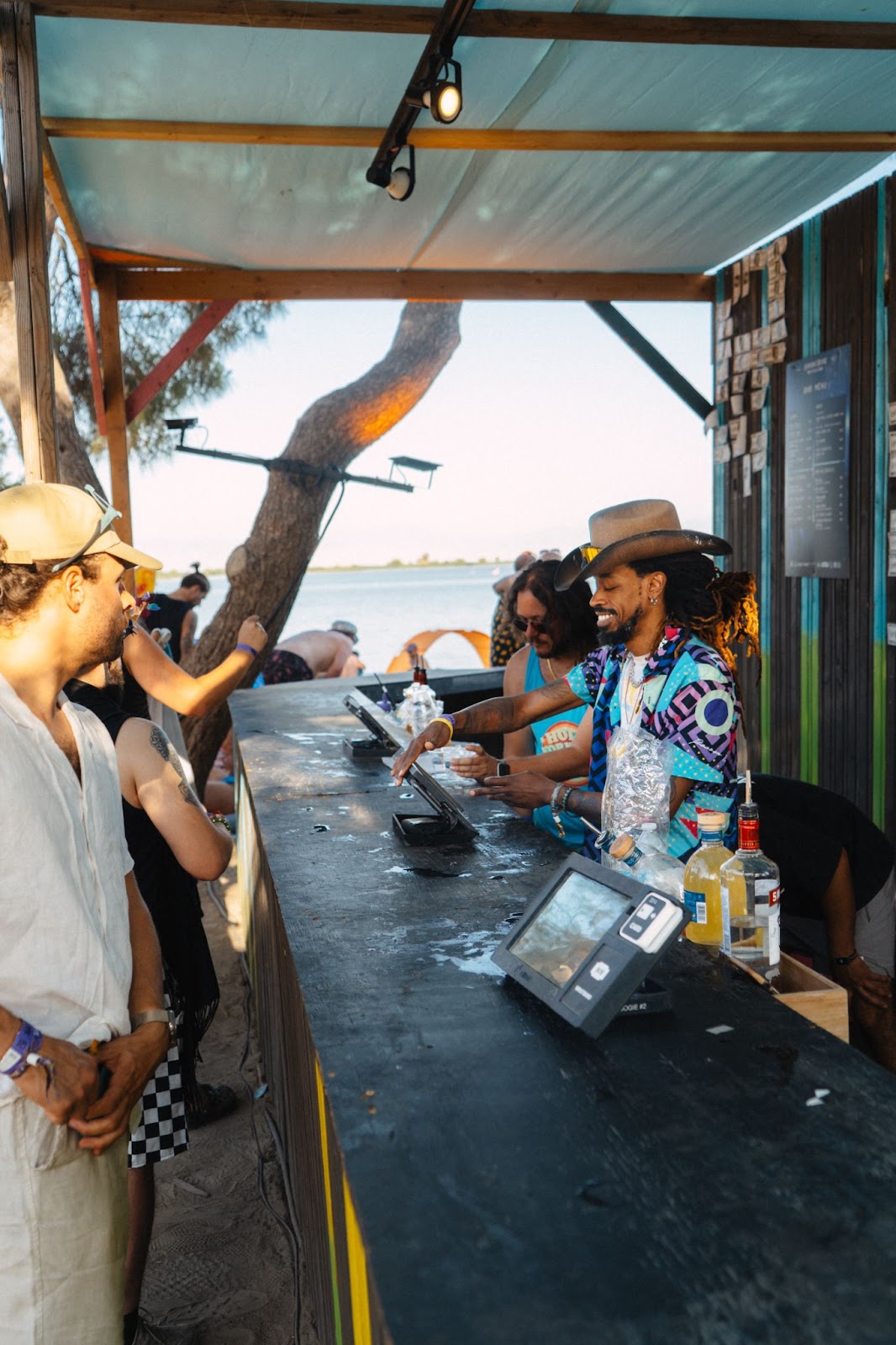 A man serves beverages at a cashless event, representing the ROI possible for business owners