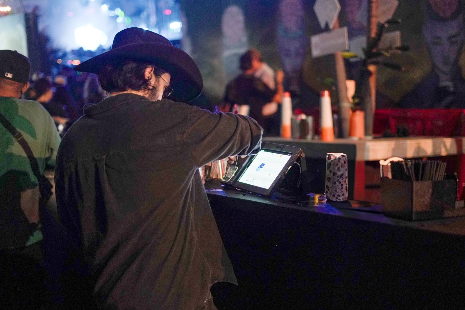 Event attendees using RFID wristbands for fast cashless payments