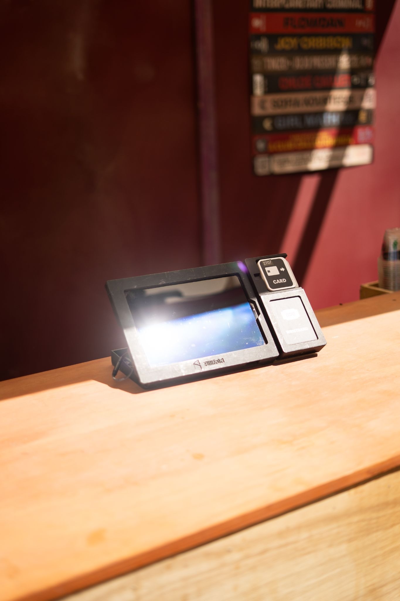 RFID payment system sits on counter at a festival, ready for use.
