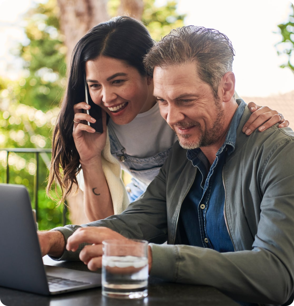 Two people looking at laptop